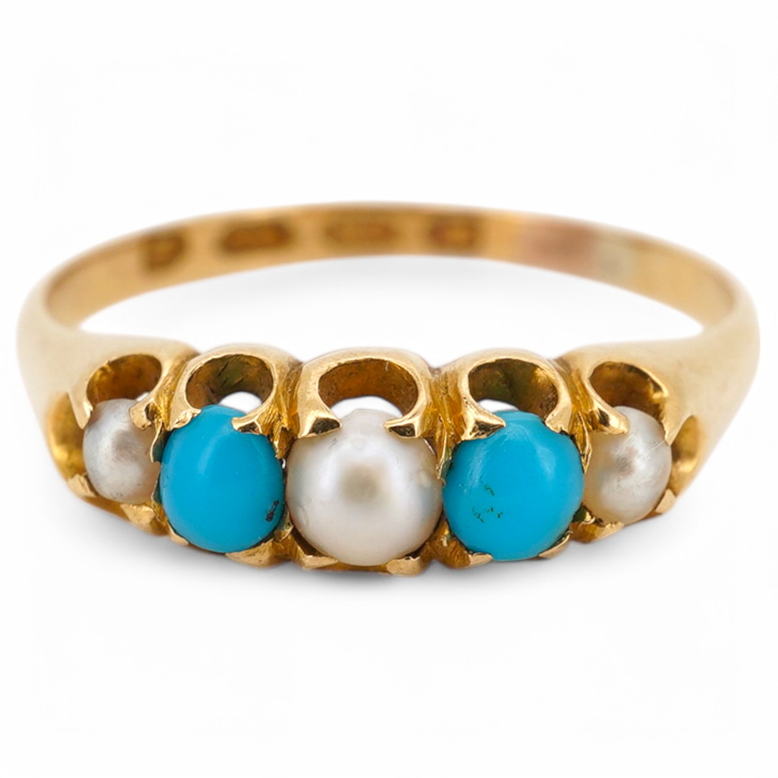 A Victorian 18ct gold, three stone split pearl and two stone turquoise set half hoop ring, size O/P, gross weight 2.5 grams.